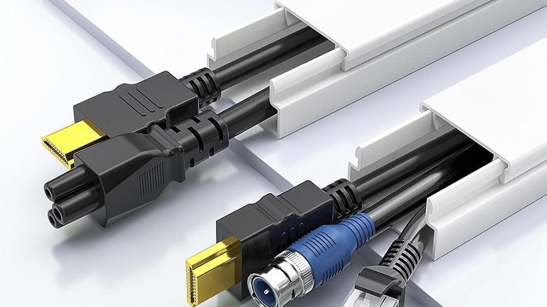 A pair of Delamu Cord Hiders with three cables each inside.