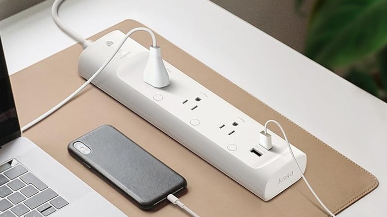 Two devices connected to a white smart plug.