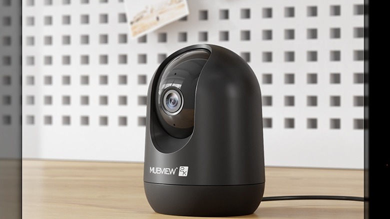 Black MubView corded camera placed on a wooden surface.