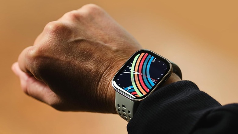 Amazfit Bip 6 Smart Watch on a man's wrist displaying the time