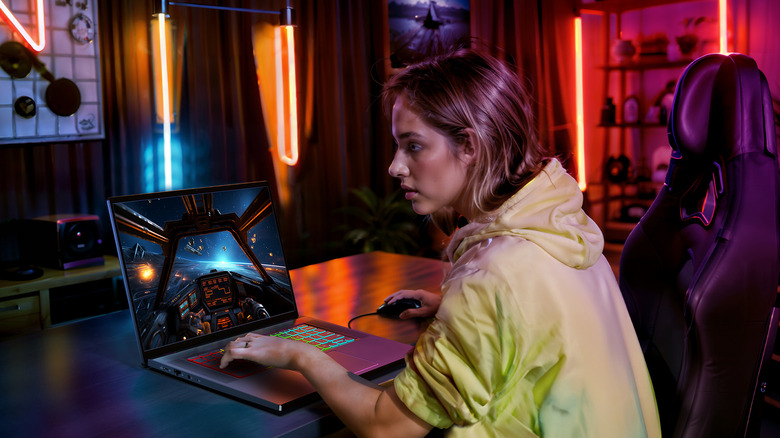 A person using the Acer Chromebook 516 GE to game