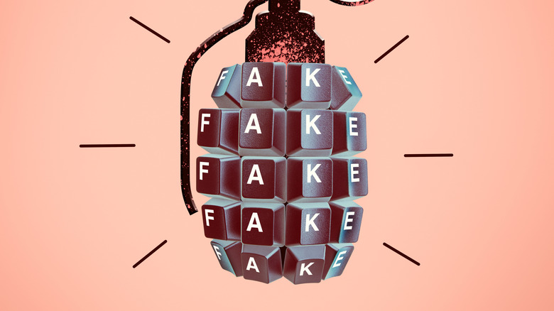 Wall art of a grenade made of keyboard caps, spelling "fake."
