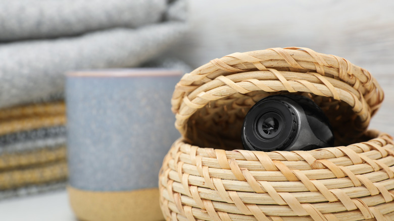 camera hidden inside a wicker basket