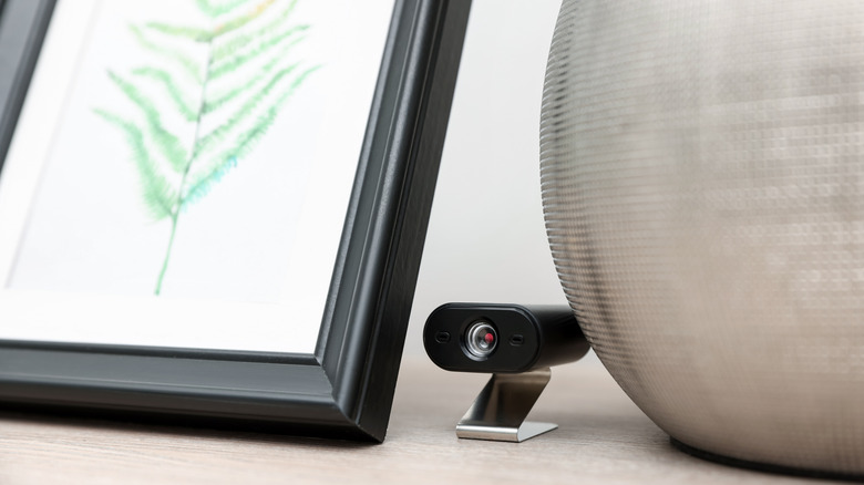 camera hidden behind photo frame