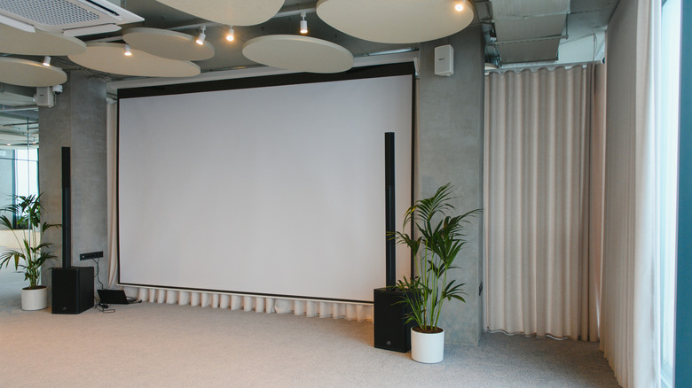 A white projection screen in an elegant venue