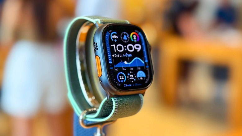The Apple Watch Ultra 3 on a display stand against a blurred background.