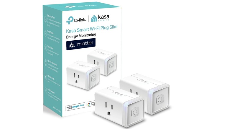 Two units of the Kasa KP125M smart plug and their box, on a white background.