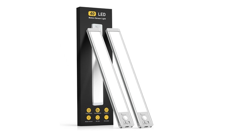 Two units of the MCGOR GLS-C010 motion sensor lights with their box, on a white background.
