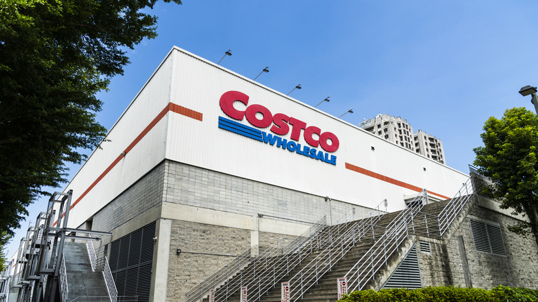 The Costco logo on the corner of a building.