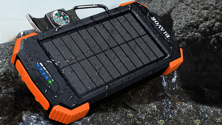 The Blavor PN-W05 solar power bank, wet and on some rocks.