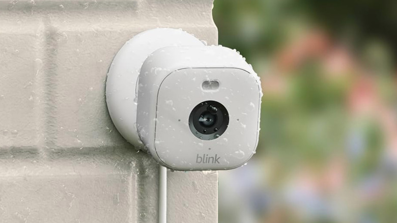 white blink camera unit in the rain