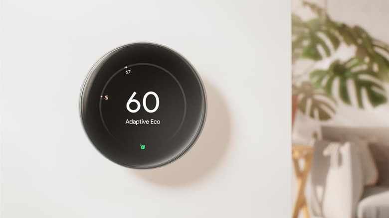 Google Nest Learning Thermostat (4th Gen) mounted on a wall and showing the temperature