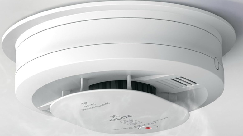 Kidde smoke and carbon monoxide detector in white mounted on a ceiling