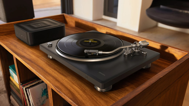 The Denon DP-500BT turntable on a wooden desk