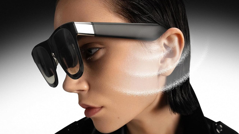 A woman wearing a pair of XREAL One Pro AR Glasses.