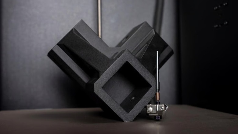 Prusa's HT hotend upgrade next to a part printed from high-temperature filament