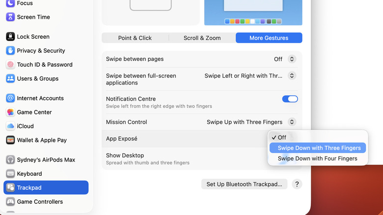 The "Swipe Down with Three Fingers" option highlighted in blue under the macOS "App Exposé" feature.
