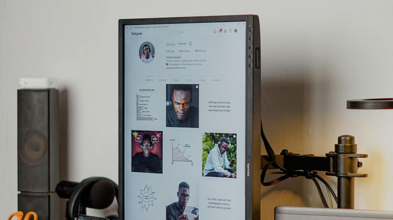 A very tall vertical monitor on a desk