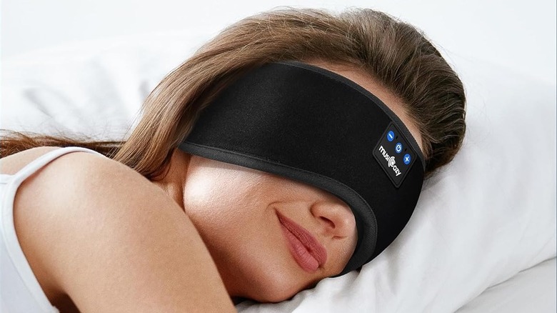 A person sleeping while wearing the Musicozy Sleep Headphones