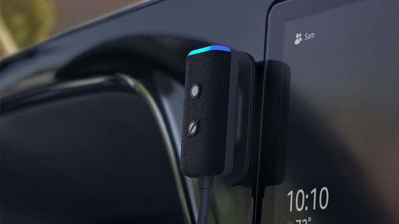The Amazon Echo Auto smart speaker on the dashboard of a car.