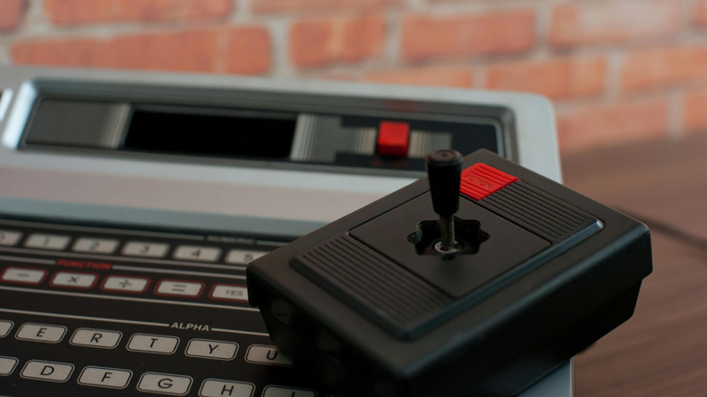 The Magnavox Odyssey 2 in front of a brick wall