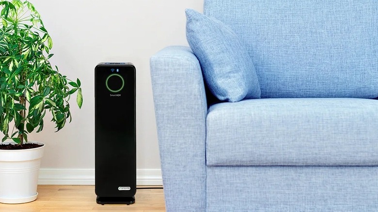 The GermGuardian CDAP4500BCA air purifier beside a sofa.