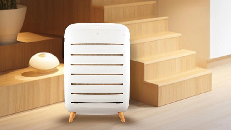 The HoMedics AP-C500 air purifier placed at the bottom of a set of stairs.