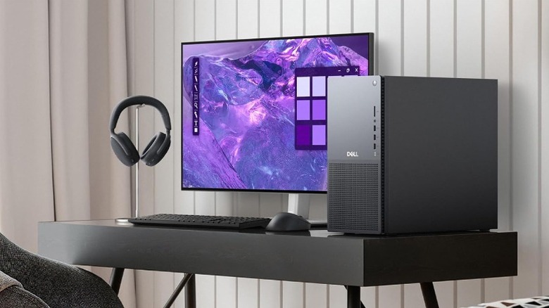 Dell tower gaming PC with a complete PC setup placed on a desk.
