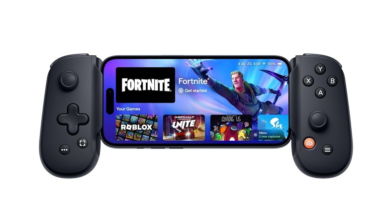 An iPhone showing Fortnite, cradled inside a mobile game controller.