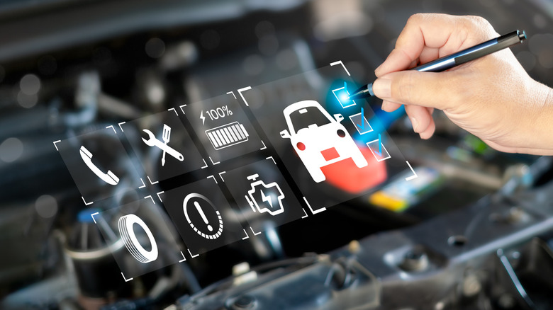 Holographic view of different car repair symbols