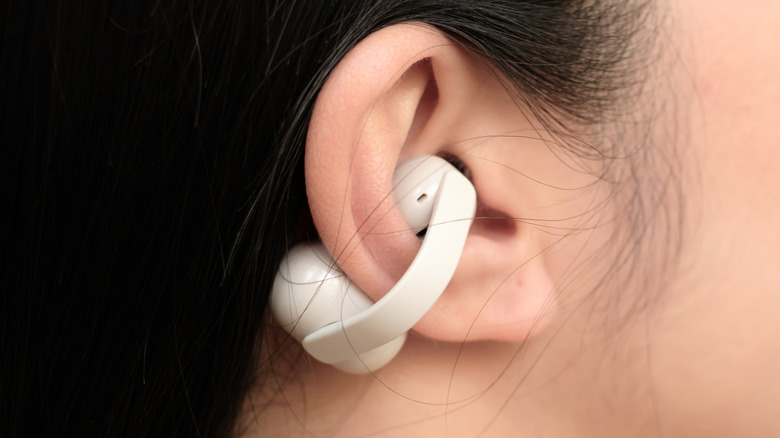 Close-up of a person wearing the Sony LinkBuds Clip open-ear wireless earbuds