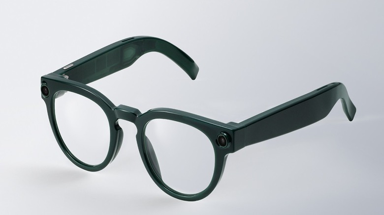 A pair of Warby Parker-designed Samsung smart glasses against a white-to-gray gradient background