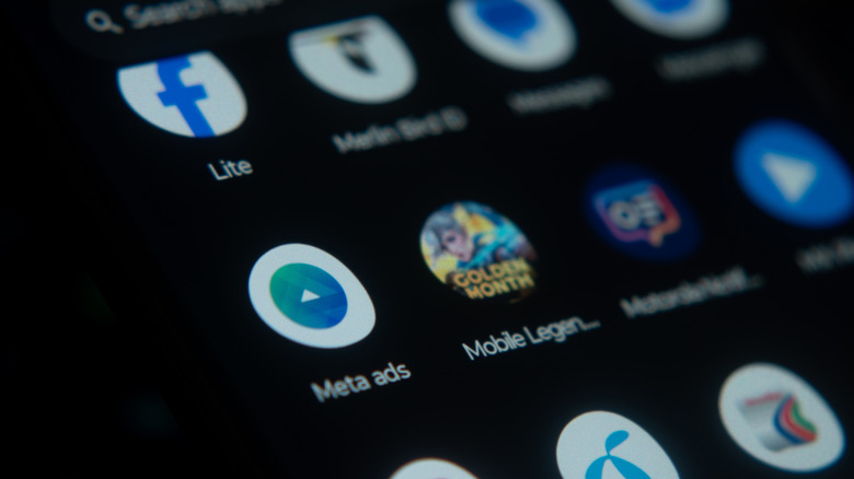 Various app icons on a smartphone with a black wallpaper