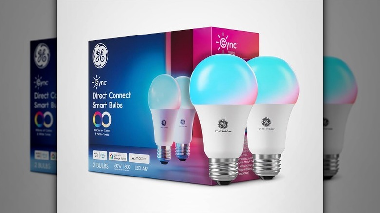 Box of Cync smart light bulbs with two bulbs placed on the side.