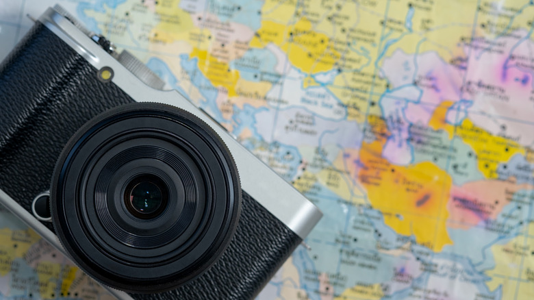 A camera placed on top of a map.