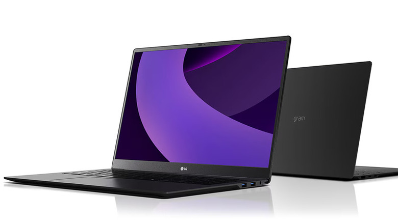 Two slim black laptops displayed against a white background.