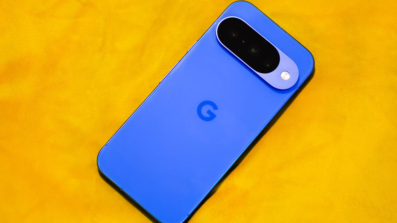 A blue Google Pixel 10 on a table.