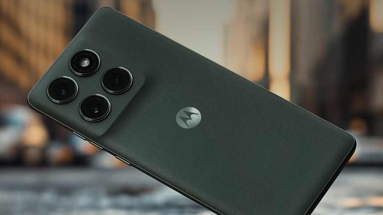 The Motorola Edge in front of a city street.