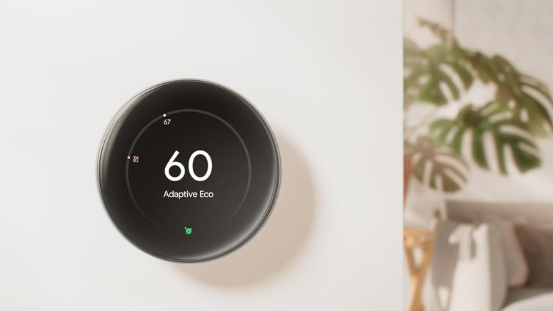 The Google Nest Learning Thermostat (4th Gen) on the wall of a home.