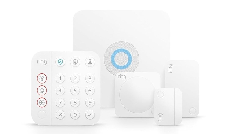 The contents of the 5-piece kit of the Ring Alarm security system, on a white background.
