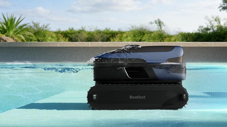 The Beatbot Sora 70 robotic pool cleaner in the shallow part of the swimming pool.
