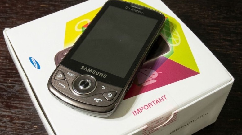A Samsung Behold II Android phone sitting on top of its box.