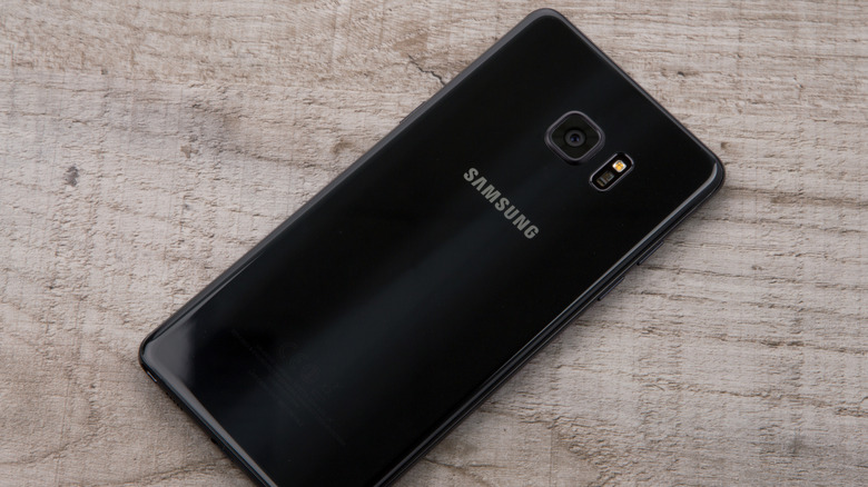A Samsung Galaxy Note 7 lying screen side down on a table.