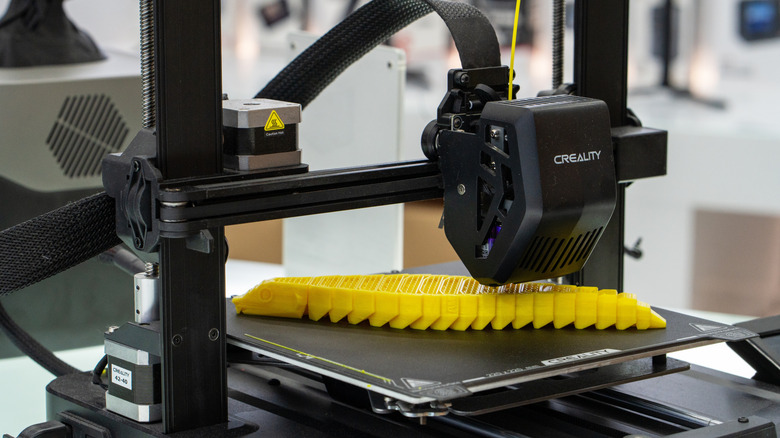 A Creality bed-slinger FDM printer printing an object.