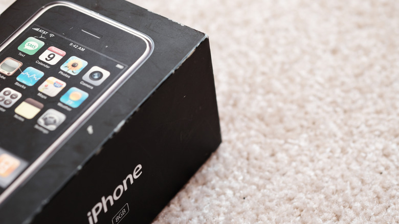Close-up photo of the original first generation iPhone in its retail box.
