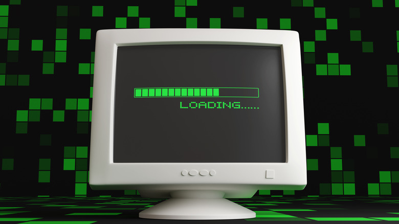 A CRT on a green digital landscape with a loading bar on its display.