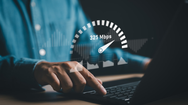 A laptop displaying a speed test reading, representing fast internet performance and bandwidth.