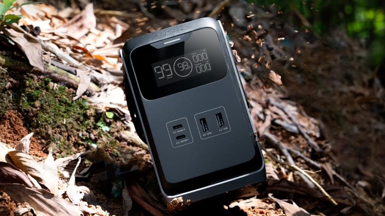 The EcoFlow Trail 200 portable power station on the ground, outdoors.