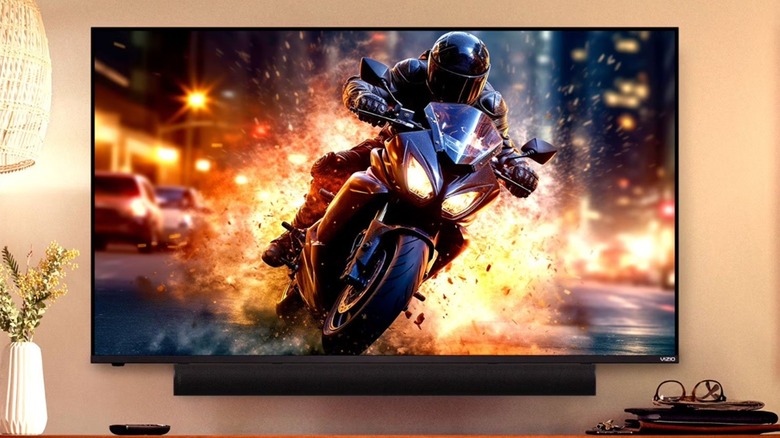 The Vizio 2.1 All-in-One soundbar installed just below a wall-mounted TV.