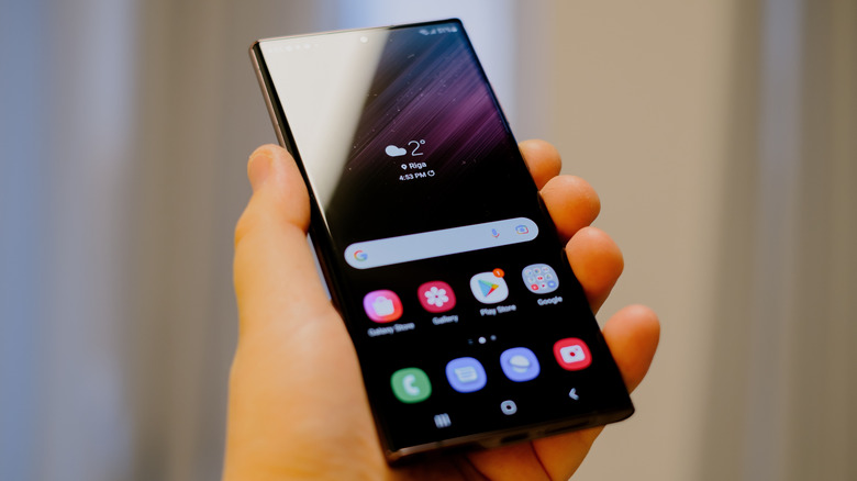 Someone holding a Samsung Galaxy S22 phone